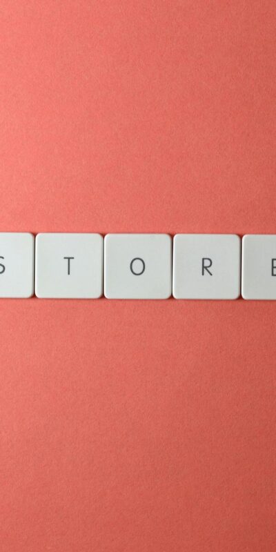 Minimalist conceptual image with 'STORE' spelled out on a red background, perfect for ecommerce themes.